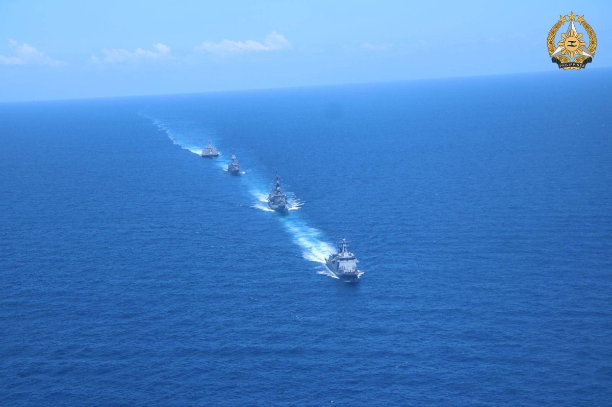 In this handout photo taken and received on April 7, 2024 from the Armed Forces of the Philippines (AFP), shows BRP Antonio Luna leading the three other participating ships in a column formation during the Division Tactics/Officer of the Watch maneuver exercise during the first Multilateral Maritime Cooperative Activity between the Philippines, US, Australia and Japan, in South China Sea. AFP PHOTO / Armed Forces of the Philippines 