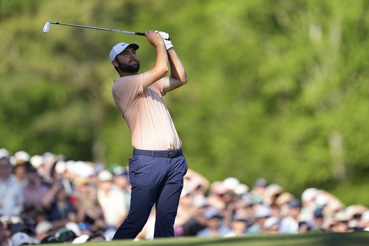 Scottie Scheffler watches his tee shot on the 12th hole during final round at the Masters golf tournament at Augusta National Golf Club Sunday, April 14, 2024, in Augusta, Georgia. AP PHOTO