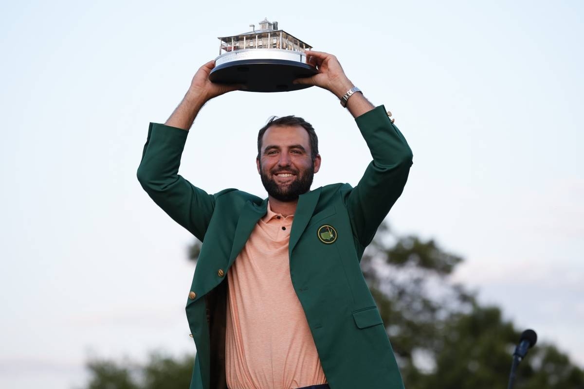 Scottie Scheffler holds the trophy after winning the Masters golf tournament at Augusta National Golf Club Sunday, April 14, 2024, in Augusta. AP PHOTO