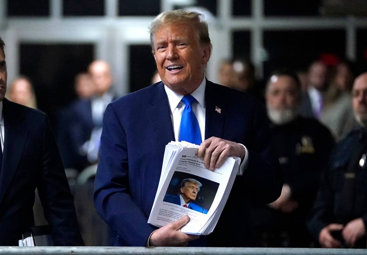 NO COVER-UP Former US president Donald Trump holds news clippings during his trial for allegedly covering up hush money payments linked to extramarital affairs at Manhattan Criminal Court in New York City on Thursday, April 18, 2024. AFP Photo