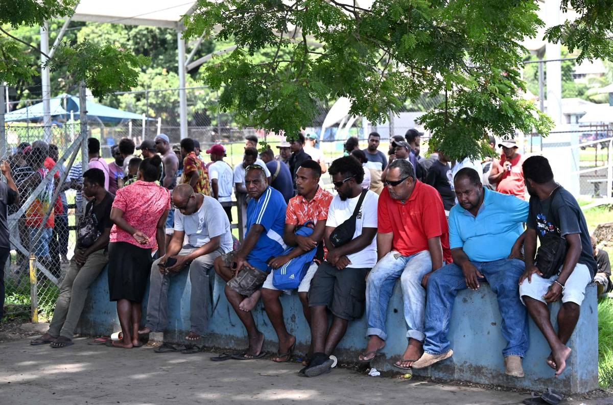 AWAITING RESULTS People gather outside a voting center in Honiara, capital city of the Solomon Islands, on Thursday, April 18, 2024, a day after the general elections. AFP Photo