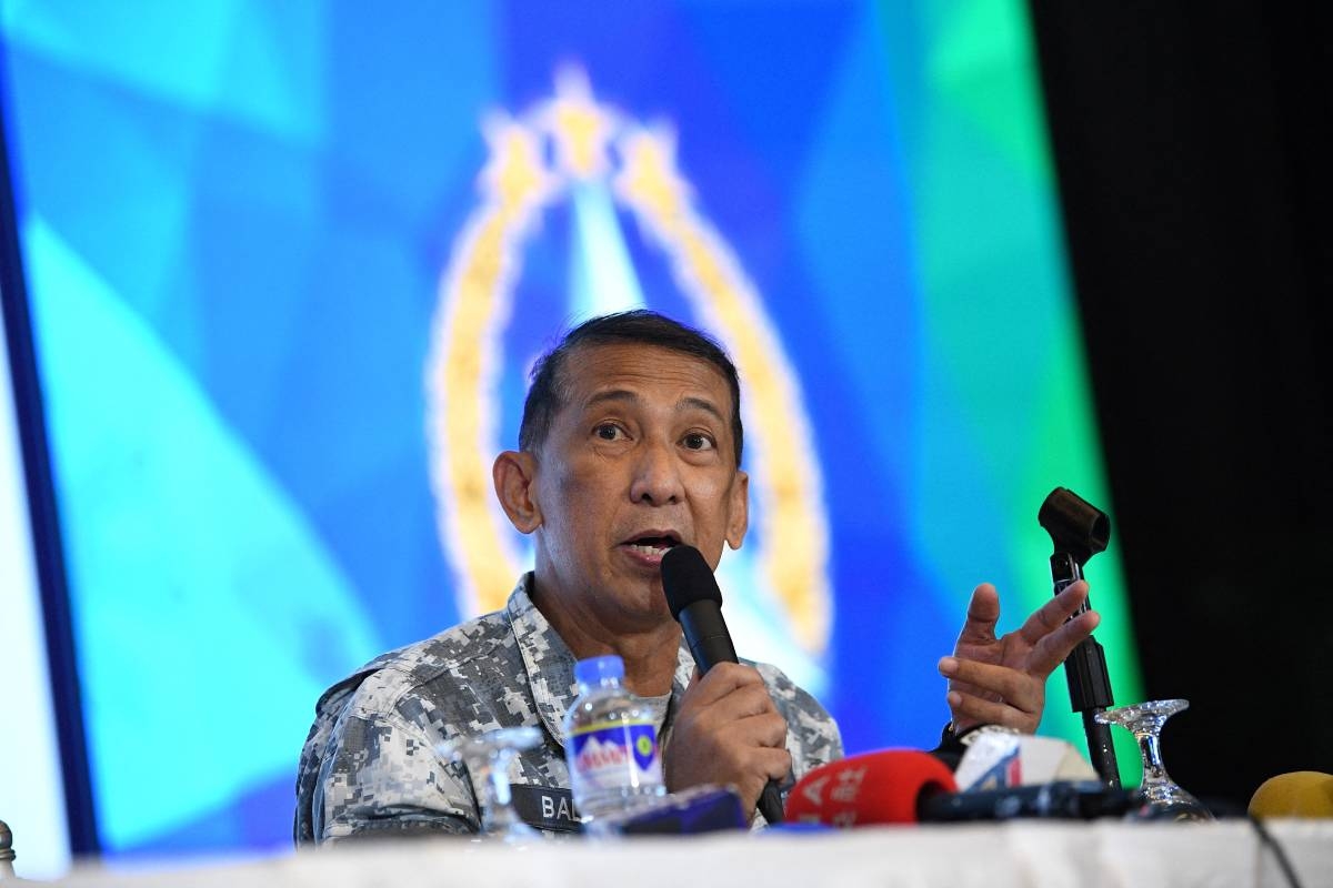 Philippine Coast Guard spokesperson Rear Admiral Armando Balilo speaks during a press conference at the military headquarters in Manila on April 22, 2024, after the opening ceremony of the Philippine and US annual joint military exercise. PHOTO BY TED ALJIBE / AFP