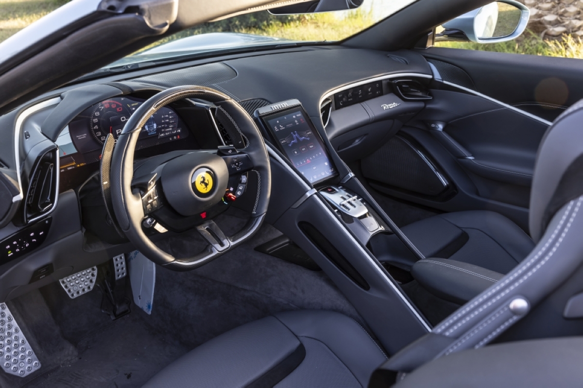 Inside, the Ferrari Roma Spider features supple leather upholstery and state-of-the-art infotainment system.