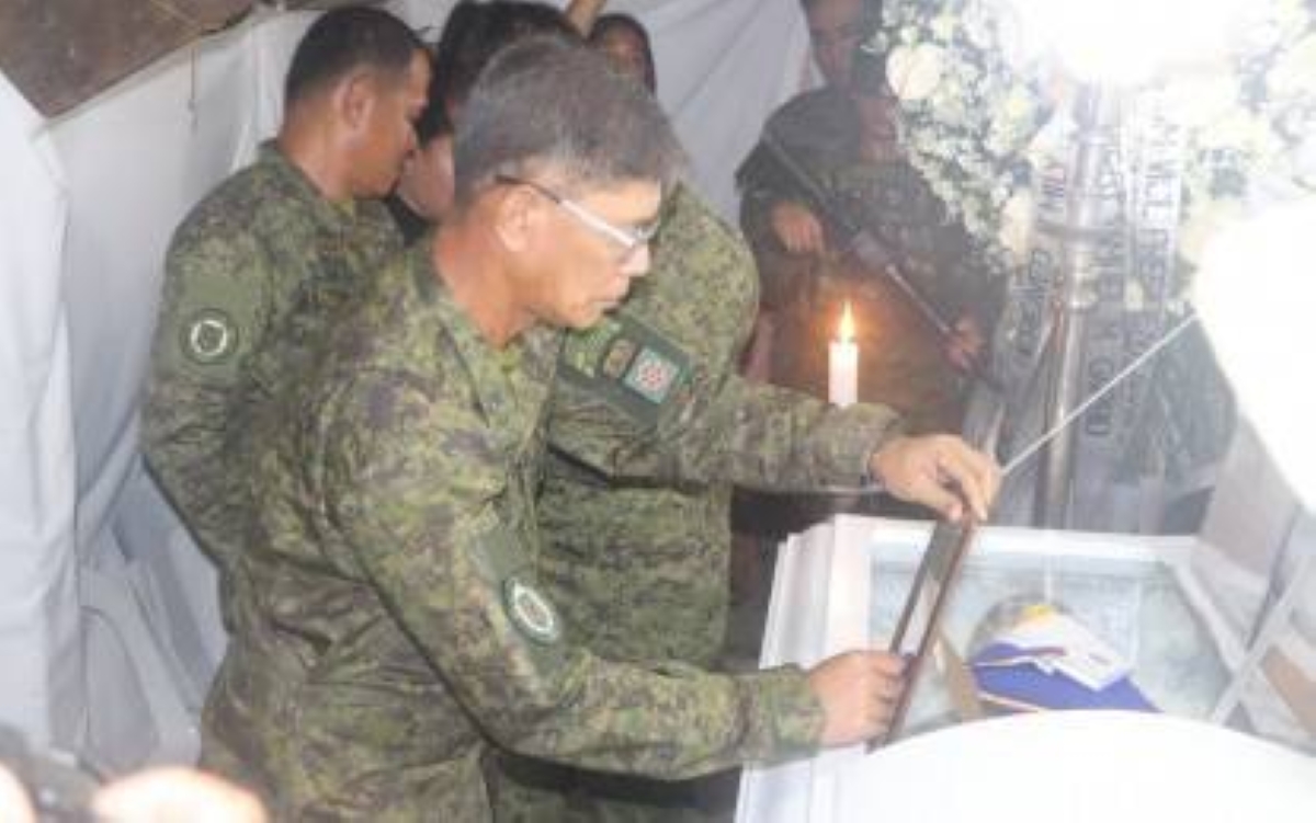 HERO Brig. Gen. Noel Vestuir, commander of the Army's 802nd Infantry Brigade, awards a medal to a soldier who died while saving two children from drowning in Borongan City, Eastern Samar, on April 8, 2024. He was honored for his unselfish act of sacrificing his life to save the children. PHOTO COURTESY OF PHILIPPINE ARMY