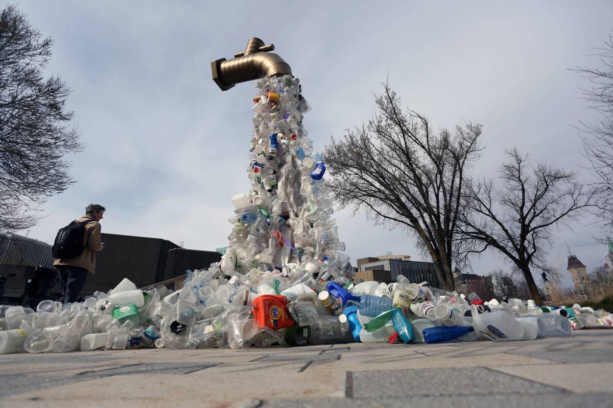A sculpture titled "Giant Plastic Tap" by Canadian artist Benjamin Von Wong is displayed outside the fourth session of the UN Intergovernmental Negotiating Committee on Plastic Pollution in Ottawa, Canada, on April 23, 2024. Dave Chan / AFP
