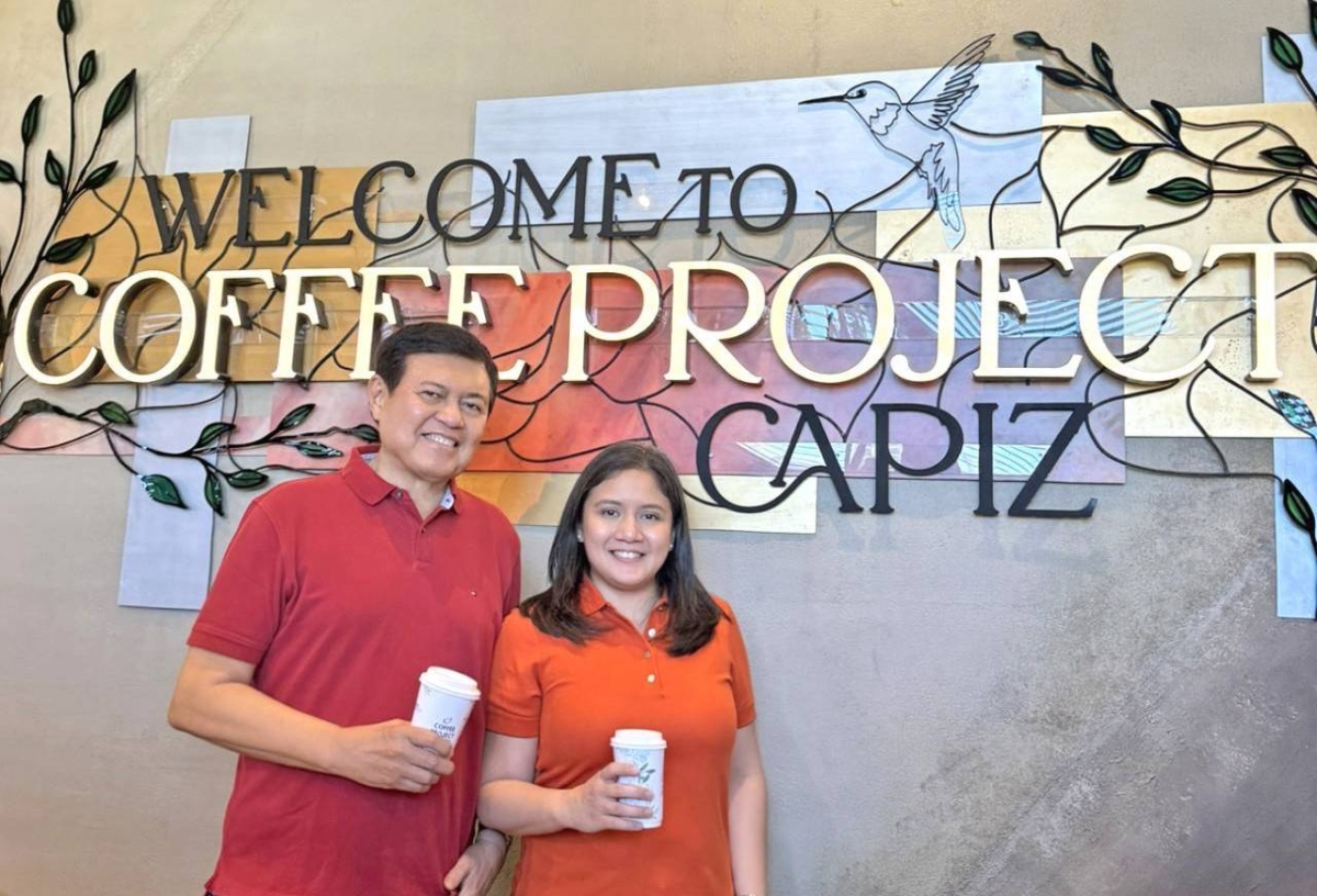 Villar Group Chairman Manny Villar (left) and AllValue Holdings Corp. President and Chief Executive Officer Camille Villar grace the opening of Coffee Project Capiz. CONTRIBUTED PHOTO