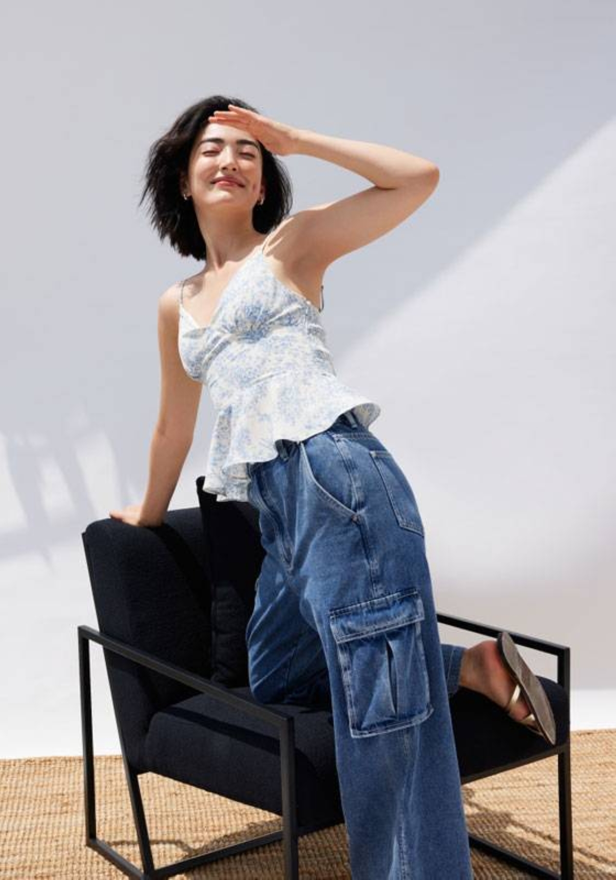 Fresh and playful in padded floral peplum camisole top and denim cargo straight leg jeans.
