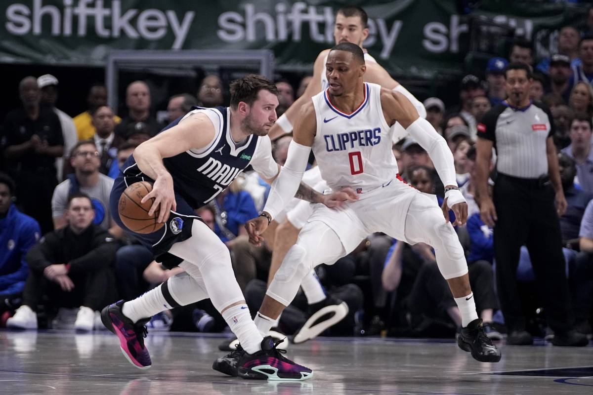 Dallas Mavericks guard Luka Doncic, left, works against Los Angeles Clippers guard Russell Westbrook (0) during the first half in Game 2 of an NBA basketball first-round playoff series in Dallas, Friday, April 26, 2024. AP PHOTO