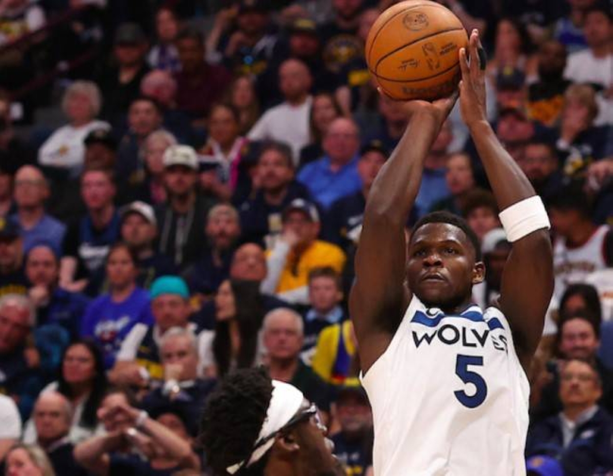 Anthony Edwards of the Minnesota Timberwolves shoots a three point basket against Reggie Jackson of the Denver Nuggets during the NBA Western Conference second round playoffs at Ball Arena on Saturday, May 4, 2024, in Denver, Colorado. AFP PHOTO