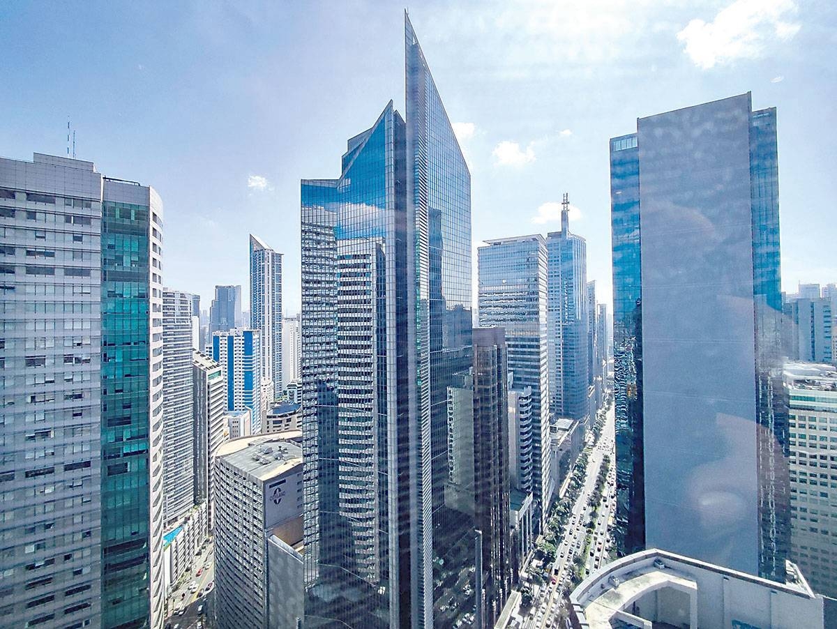 TRIMMED This photo dated Feb. 17, 2023 shows the Makati skyline from Ayala Avenue. The International Monetary Fund lowered its growth forecast for the Philippines this year to 5.3 percent from 6.0 percent after a dismal showing at the second quarter. PHOTO BY J. GERARD SEGUIA