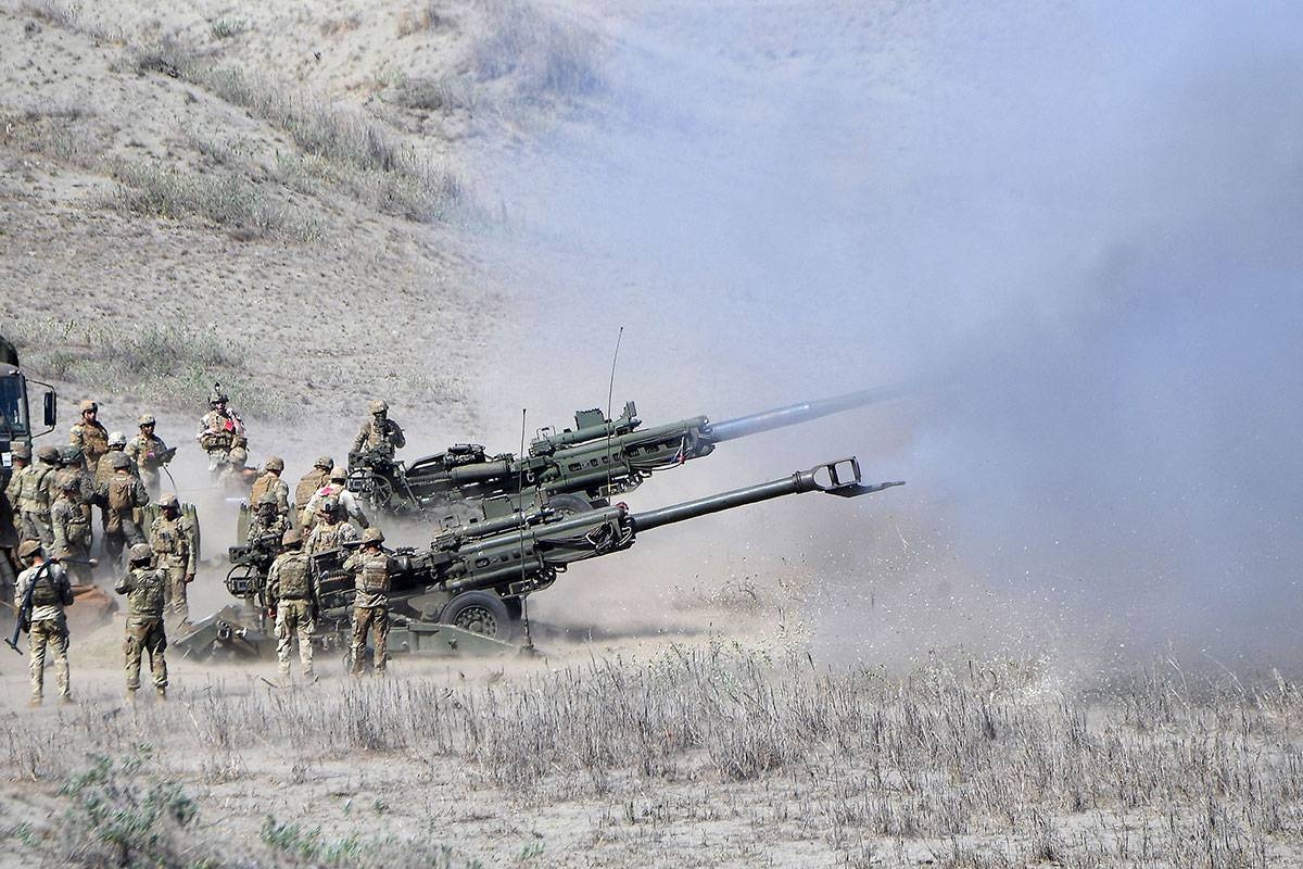 WAR GAMES US and Philippine Marines fifire M198 155mm howitzer artillery during a live fifire exercise against an imaginary ‘invasion’ force as part of the joint US-Philippines annual military Balikatan drills on a strip of sand dunes in Laoag on Monday, May 6, 2024. AFP PHOTO