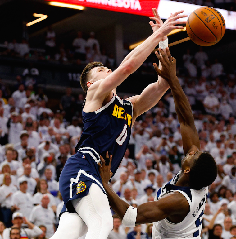 Anthony Edwards (right) of the Minnesota Timberwolves knocks the ball away from Christian Braun of the Denver Nuggets during Game 4 of the Western Conference Playoffs at Target Center on May 12, 2024, in Minneapolis, Minnesota. AFP PHOTO