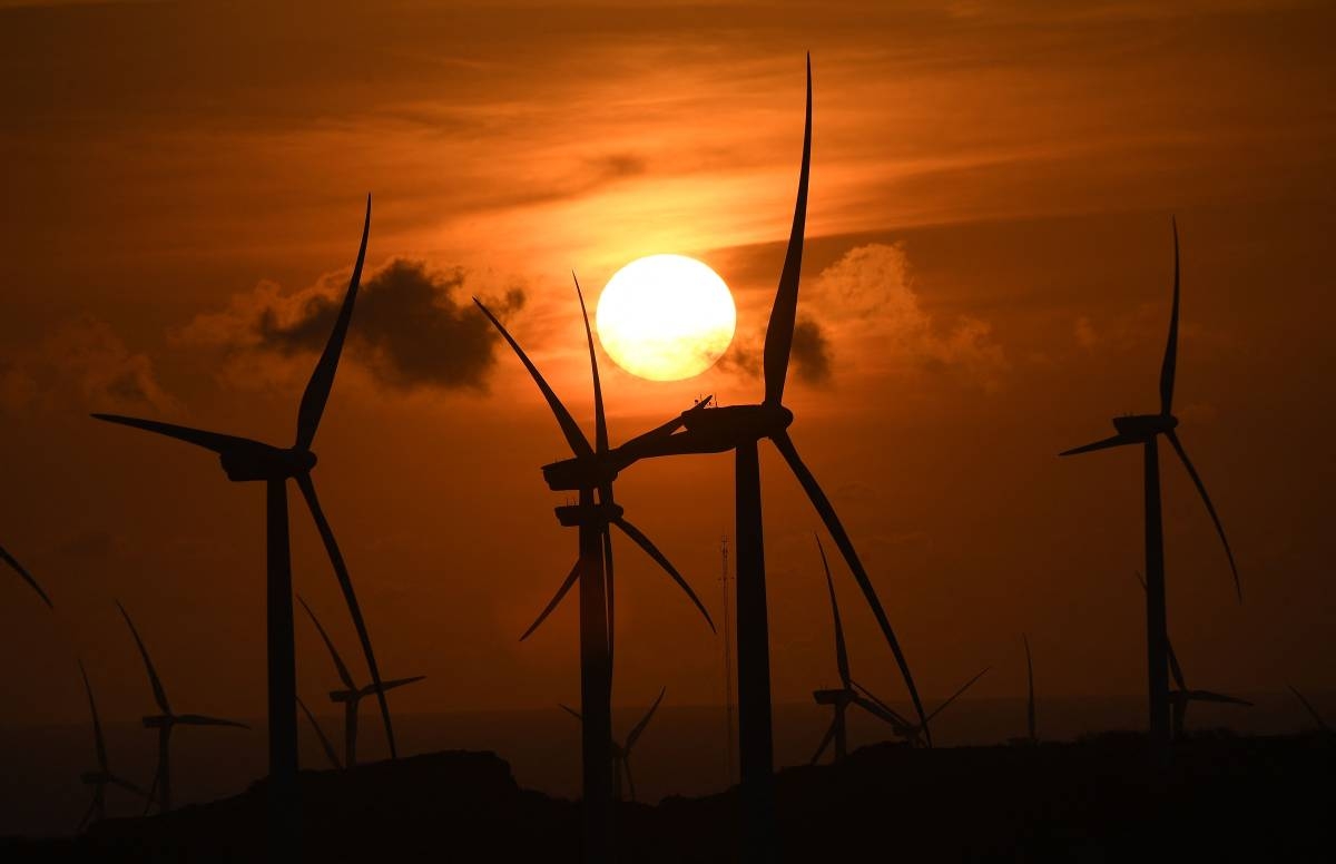 A sunset backdrops windmills in Burgos town in Ilocos Norte. AFP PHOTO