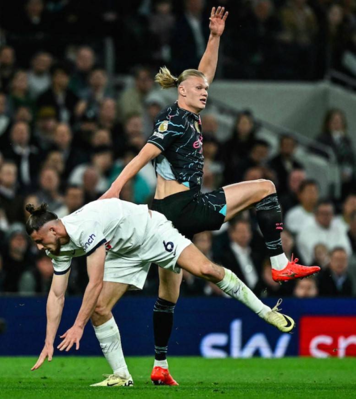 Tottenham Hotspur’s Radu Dragusin (left) fights for the ball with Manchester City’s Erling Haaland during the English Premier League football match at the Tottenham Hotspur Stadium in London on May 14, 2024. AFP PHOTO