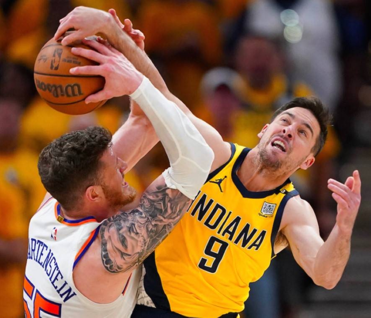 McConnell (9) of the Indiana Pacers battles Isaiah Hartenstein of the New York Knicks for a rebound during the third quarter in Game 6 of the Eastern Conference Second Round Playoffs at Gainbridge Fieldhouse on May 17, 2024 in Indianapolis, Indiana. AFP PHOTO