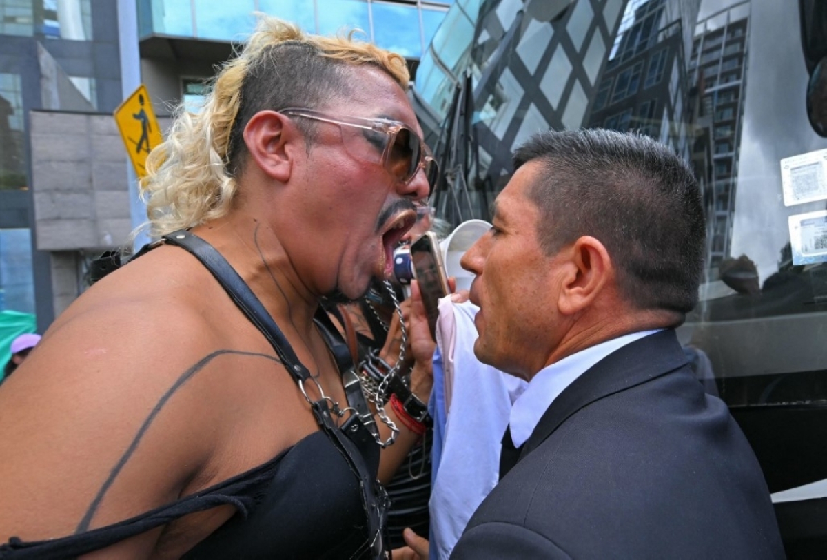 FACE-OFF An LGBTQ protester yells to a man during a rally in front of Peru’s embassy in Ecuador’s capital Quito on May 17, 2024, commemorated as the International Day Against Homophobia, Biphobia and Transphobia. AFP PHOTO
