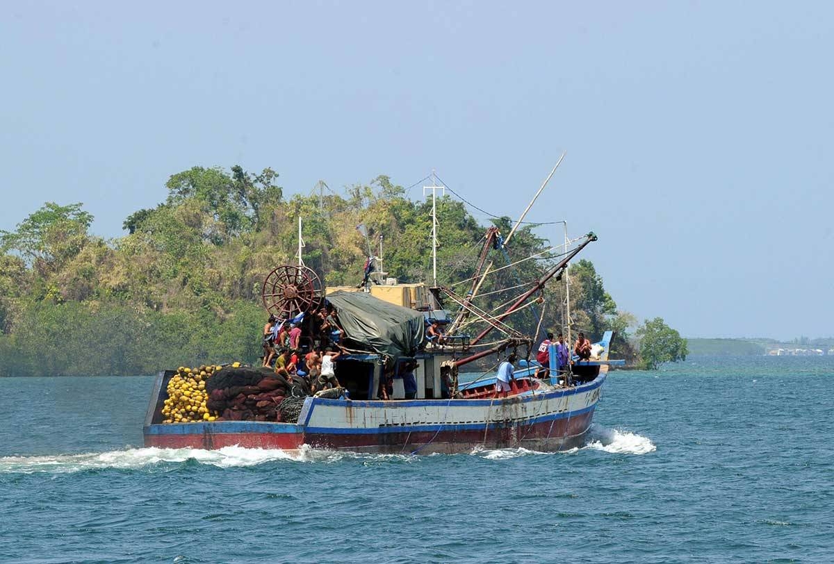 This file photo taken on May 10, 2012 shows a Filipino-owned fishing boat sailing off for a fishing expedition near the Scarborough Shoal from the port of Masinloc town, Zambales province, north of Manila.  AFP PHOTO/TED ALJIBE/FILES