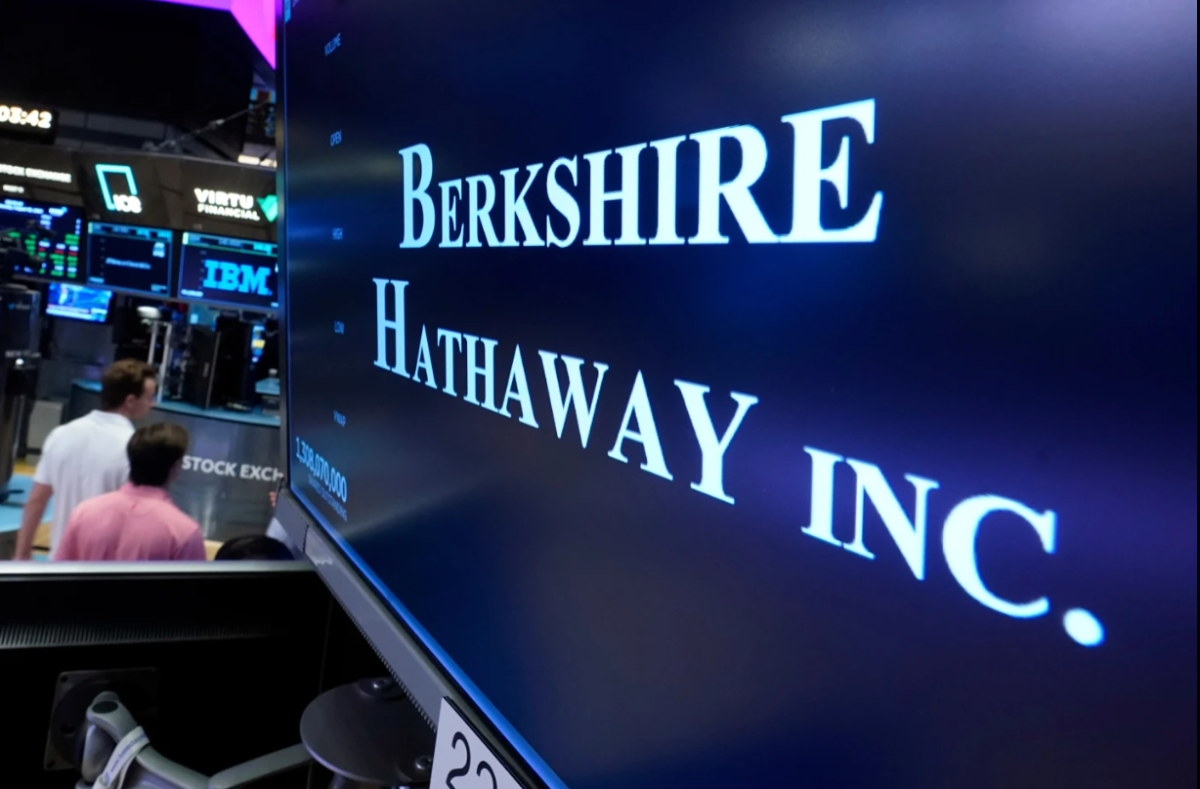 The logo for Berkshire Hathaway Inc. is displayed at a trading post on the floor of the New York Stock Exchange. AP PHOTO 