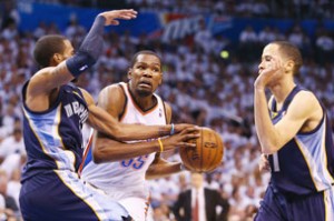 OKLAHOMA CITY, OK - MAY 15: Kevin Durant #35 of the Oklahoma City Thunder is fouled by Mike Conley #11 of the Memphis Grizzlies during Game Five of the Western Conference Semifinals of the 2013 NBA Playoffs at Chesapeake Energy Arena on May 15, 2013 in Oklahoma City, Oklahoma.  Ronald Martinez/Getty Images/AFP