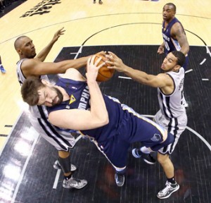 Marc Gasol No. 33 of the Memphis Grizzlies attempts to control a rebound against Boris Diaw No. 33 and Cory Joseph No. 5 of the San Antonio Spurs during Game Two of the Western Conference Finals of the 2013 NBA Playoffs at AT&T Center in San Antonio, Texas. AFP PHOTO