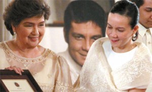  In this file photo, Grace Poe Llamanzares, along with her mother, actress Susan Roces, receives the National Artist award conferred on her father, Fernando Poe Jr. MALACAÑANG PHOTO 