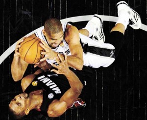 SAN ANTONIO: Tim Duncan No.21 of the San Antonio Spurs shoots over Chris Bosh No.1 of the Miami Heat during Game Four of the 2013 NBA Finals at the AT&T Center in San Antonio, Texas. AFP PHOTO