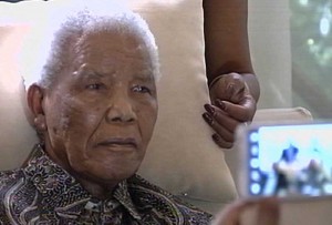 A picture released by South African broadcaster SABC shows South African peace icon Nelson Mandela sitting at his home in Johannesburg on April 29, 2013. AFP PHOTO
