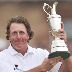  US golfer Phil Mickelson  holds the Claret Jug after winning the 2013 British Open Golf Championship at Muirfield golf course at Gullane in Scotland. AFP PHOTO 