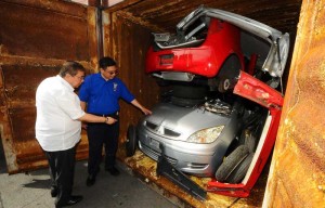 Customs Commissioner Ruffy Biazon and Cebu collector Edward dela Cuesta conduct ocular inspection of P255-million contraband goods including rice, a Nissan England ambulance, used clothing, motorcycles, tires, Mitsubishi Colt and Mazda Elf at the Port of Cebu City. Photo Courtesy Of Customs