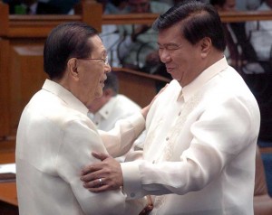 Former Senate president Juan Ponce Enrile greets his successor, Franklin Drilon after the latter was elected as head of the chamber on Monday. PHOTO BY EDWIN MULI