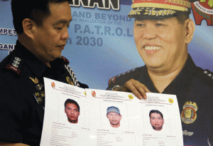 PNP's Public Information Office chief Reuben Theodore C. Sindac shows sketches of three supects in the blast that rocked Cagayan De Oro City on Sunday, leaving six persons dead and more than 30 others injured during a press briefing in Camp Crame on Monday.  Photo By Mike De Juan