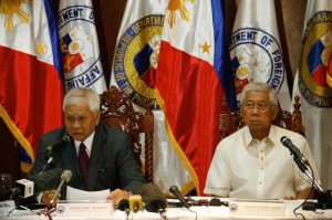 Foreign Secretary Albert del Rosario gives his opening statement while Defense Secretary Voltaire Gazmin listens during a briefing on Monday on the negotiations to increase the US presence in the country. Photo By Miguel De Guzman