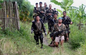 Soldiers patrol the hills of Aleosan, North Cotabato on the southern Philippine island of Mindanao on August 10, 2013. AFP PHOTO