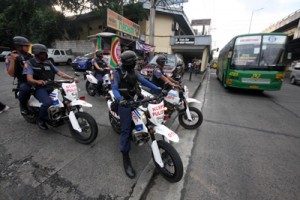 Motorcyle-riding policemen begin patrolling EDSA in Quezon City on Friday as part of the beefed-up security for Metro Manila to thwart a terrorist attack. There are reports that terrorist groups responsible for deadly bombings in Mindanao recently could launch attacks in Metro Manila. PHOTO BY MIGUEL DE GUZMAN 