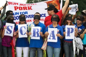 The big rally isn’t until Monday, but a handful of volunteers against pork barrel trooped to the Rizal Park on Friday to make known their opposition to the Priority Development Assistance Fund.  Photo By Alexis Corpuz 