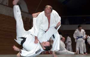 Russian President Vladimir Putin demonstrates a judo throw.  AFP FILE PHOTO