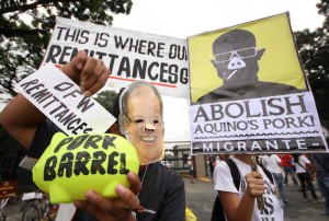 Anti-pork protesters gather in front of the House of Representatives as former Nabcor vice president Rhodora Mendoza  Photos By Miguel De Guzman 