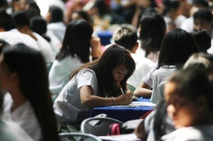 At an age of text messaging and fast mail, school children put their thoughts on pen and paper during a letter writing activity on Wednesday sponsored by the Philippine Postal Corp. to celebrate World Post Day. The project is part of PHLPost postal awareness program called SulatMulat, which aims to reintroducing the art of letter writing to students.  PHOTO BY MIGUEL DE GUZMAN 