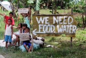 Children from Sagbayan town in Bohol beg for food and water from passing vehicles on Wednesday, nine days after the 7.2 earthquake crippled the province. Fears of famine and disease have been raised, especially in the far-flung places where the national and local governments are unable to extend assistance on a regular basis.  Photo By Rhaydz Barcia