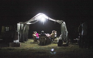 President Benigno Aquino 3rd (right, in yellow shirt) did not get much sleep when he spent the night in a tent in quake-stricken Loon town in Bohol province. With him were Social Welfare Secretary Dinky Soliman and several local officials.  Malacañang Photo 