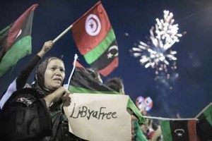 A photo taken on October 23, 2011 shows Libyans celebrating following the announcement of the liberation of the country in Martyr’s Square in central Tripoli three days after ousted despot Moamer Kadhafi was captured and killed. AFP PHOTO