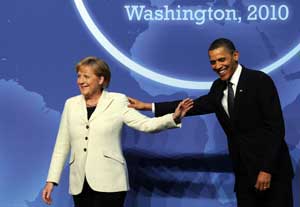 A file photo taken on April 12, 2010, shows United States President Barack Obama greeting German Chancellor Angela Merkel at the Washington Convention Center during the Nuclear Security Summit in Washington, D.C. AFP PHOTO