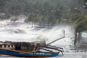 Big waves pound a sea wall in Legazpi City, Albay province. One of the most intense typhoons in recorded history slammed into central Philippines on Friday, killing at least three people and displacing millions as monster winds tore off roofs and giant waves washed away flimsy homes. AFP PHOTO