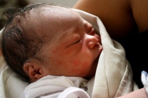 Baby Beatriz Joy is held by her mother after being born on a pile of debris. AFP PHOTO