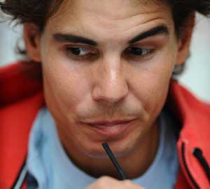 Spain’s Rafael Nadal drinks milkshake during a press conference on the first day of the ATP World Tour Finals tennis tournament in London. The world number one is set to play compatriot David Ferrer in his opening match at the season-ending ATP World Tour Finals. AFP PHOTO