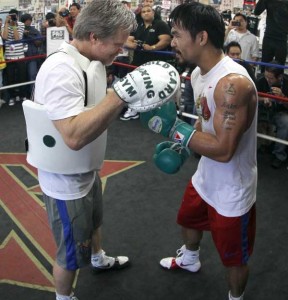 Freddie Roach (left) trains his prized pupil Manny Pacquiao in mitt hitting. AFP FILE PHOTO