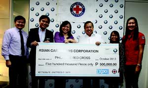 (From left) Asian Carmakers Corp. Marketing Manager Karl Magsuci, Executive Director for Sales and Marketing Glen Dasig and President Maricar Parco turn over the donation to Philippine National Red Cross Chairman Richard Gordon, Director of Fund Generation Janette Alcaraz and Program Assistant Marlyn Salanio.