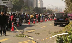 People stand on a street after an explosion outside a provincial headquarters of China’s ruling Communist Party in Taiyuan, north China’s Shanxi province. AFP PHOTO