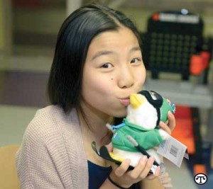 Michelle Nguyen and the adorable holiday duck she designed to help raise money for childhood cancer facilities.