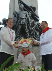 President Benigno Aquino 3rd receives a commemorative stamp honoring Andres Bonifacio at the hero’s monument in Caloocan City on Saturday. On Bonifacio’s 150th birth anniversary, Aquino called on Filipinos to promote volunteerism and lauded those who responded to the needs of the typhoon victims. MALACANANG PHOTO 